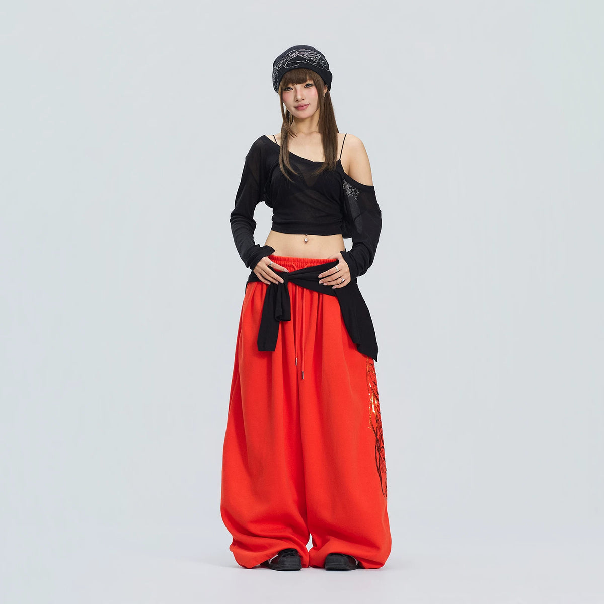 オレンジスパンコール刺繍スウェットパンツ